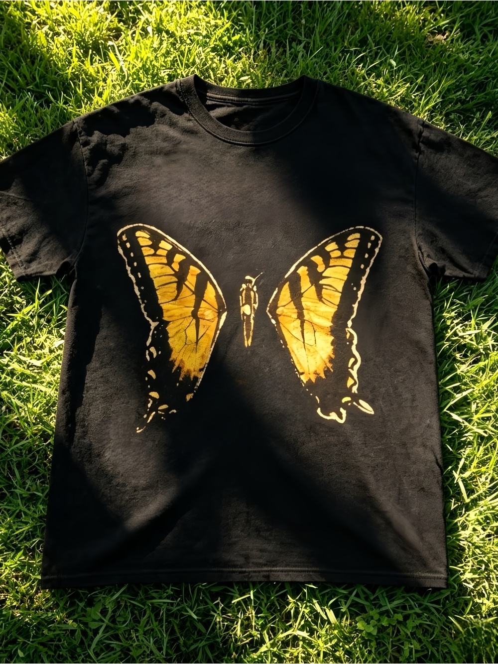 Black unisex T-shirt with butterfly pattern.